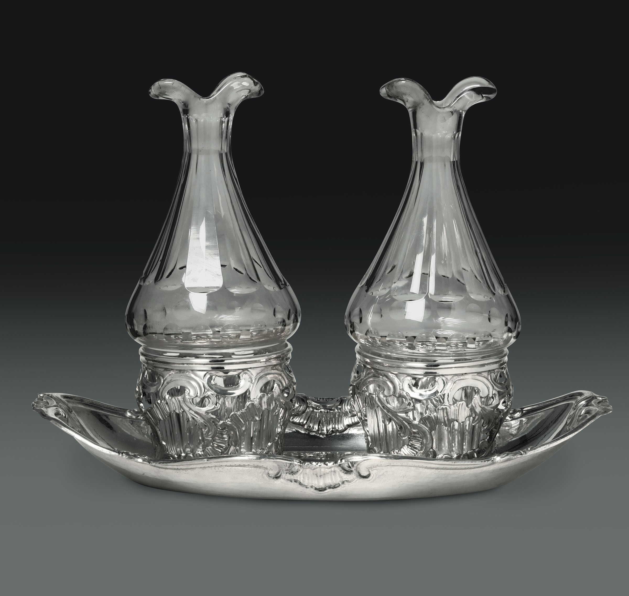 A silver cruet stand, Turin, late 17-early1800s - - An oil and vinegar cruet in [...]