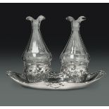 A silver cruet stand, Turin, late 17-early1800s - - An oil and vinegar cruet in [...]