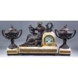 A late 19th/early 20th Century French pink veined marble and bronzed spelter mounted clock