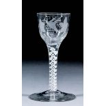 An 18th Century air twist wine glass, the bucket bowl engraved with a bird and fruiting vine, on a