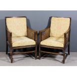 A pair of 1920's oak framed square back Bergere armchairs with moulded frames, cane panelled backs