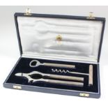 An Elizabeth II silver handled three piece bar set with cylindrical reeded handles, comprising -