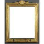 A gilt framed rectangular girandole, the moulded frame with shell and scroll cresting and with later