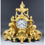 A late 19th Century French gilt brass case mantel clock, No. 15928, the 4.5ins diameter white enamel