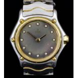 A lady's bi-metal quartz wristwatch by Ebel, Model No. 411493, the smoke coloured dial with