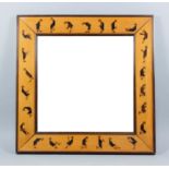 An early 20th Century birchwood framed square wall mirror, the frame inlaid with hardwood in the