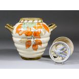 A Crown Ducal pottery two-handled vase decorated by Charlotte Rhead with "Autumn Leaves" design,