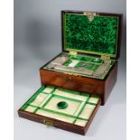A mid Victorian rosewood dressing case by Hausburg of Liverpool, the interior fitted with five glass