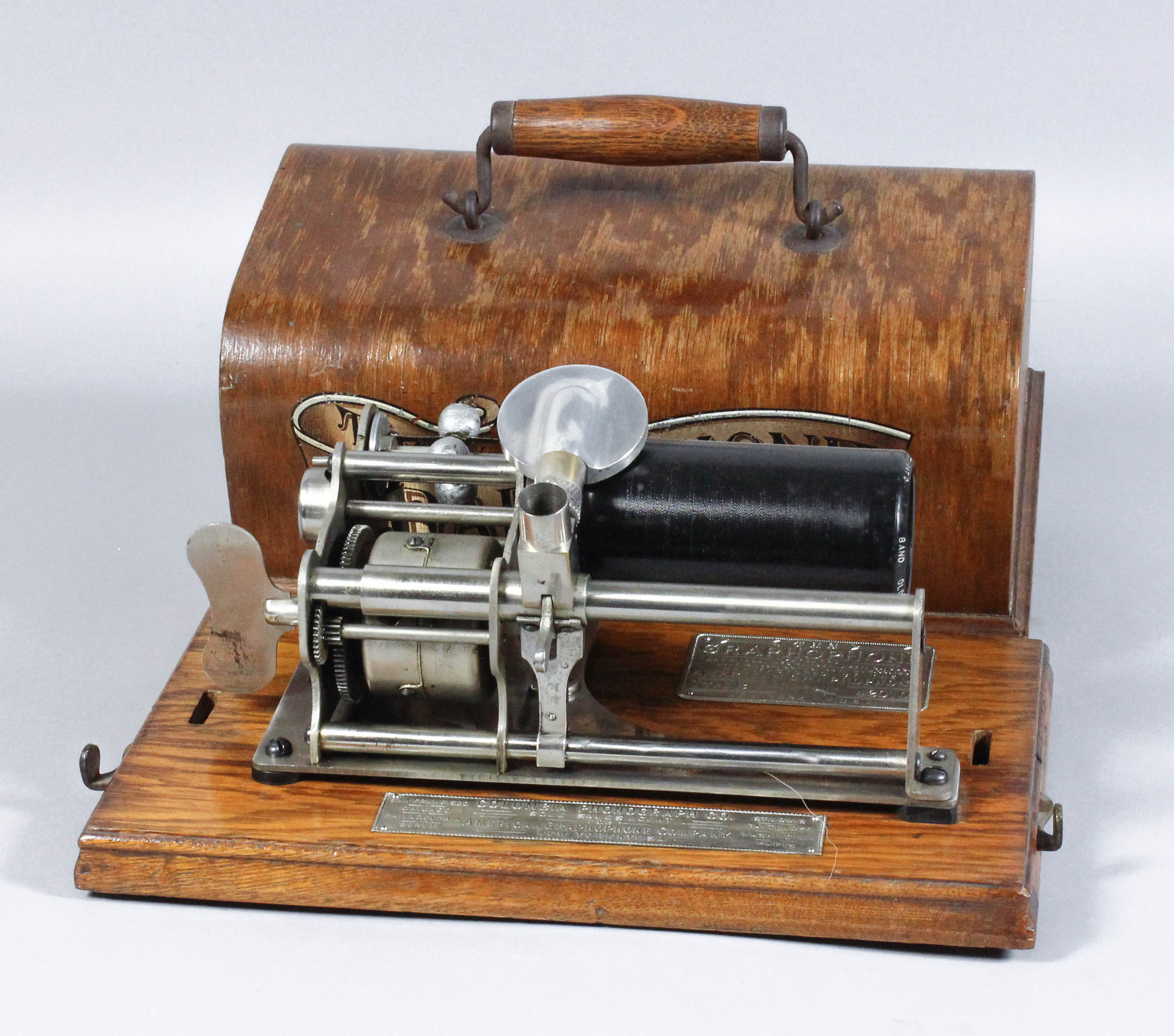 An early 20th Century oak cased Columbia "Graphophone" phonograph with key wind movement, in oak