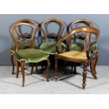A set of four Victorian walnut drawing room chairs with shaped and moulded backs, fretted splats,