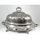 A late Victorian plated oval two-handled meat dish and domed cover by Mappin & Webb, with floral and