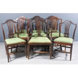 A set of six early 20th Century mahogany dining chairs of "Hepplewhite" design with arched crest