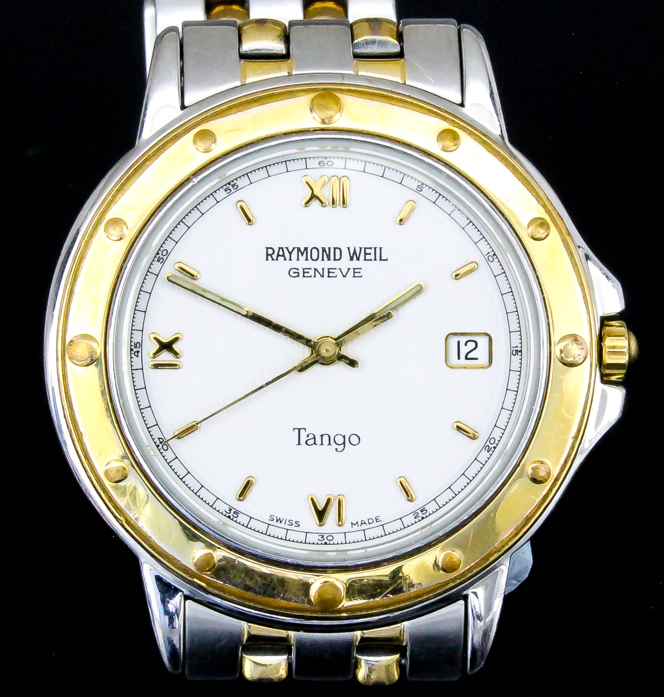A lady's quartz "Tango" wristwatch by Raymond Weil, the white dial with Roman numerals and date