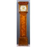 An early 18th Century walnut longcase clock by Henry Massy of London, the 12ins square brass dial