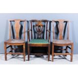 A pair of 18th Century ash dining chairs of "Country Chippendale" design with shaped crest rails,