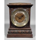 A late 19th Century German oak cased mantel clock by Winterhalter & Hofmeier, the 5.5ins diameter