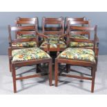 A set of eight George III mahogany dining chairs (including two armchairs), the crest rail and splat