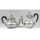 A George VI silver tea pot and matching coffee pot of "early 18th Century" design, with slightly