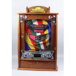 A 1950's mahogany cased Bryans "Seven Win" "Penny-in-the-Slot" Allwin, Serial No. 4650 with