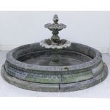 A modern Haddonstone composition stone circular fountain base, the moulded sides with tongue