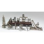 Five Chinese silvery metal toys, including - a procession of figures with a figure in a sedan chair,