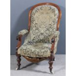 A Victorian mahogany framed spoon back open armchair with moulded frame, the seat back and arm