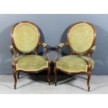 A pair of 19th Century French rosewood oval backed open armchairs with moulded showwood frame, seat,