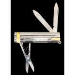 A modern "Must de Cartier" white and gold coloured metal multifunction pocket knife of reeded