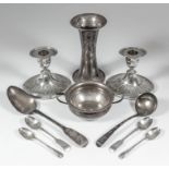 A pair of late Victorian silver pillar candlesticks of oval Neo-Classical form with reeded mounts,