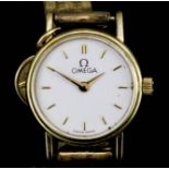 A lady's Omega 9ct gold cased wristwatch with quartz movement, the gold dial with gold numeral