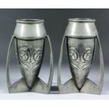 A pair of early 20th Century "Tudric" style "bomb" shaped pewter vases, attributed to Archibald