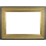 A gilt and ebonised framed rectangular wall mirror, the gilt frame moulded with oak leaves and