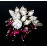 A modern 9ct white gold mounted diamond and ruby set cluster ring, set with twelve brilliant cut