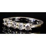 A modern 18ct white gold mounted five stone diamond ring, set with round brilliant cut diamonds (