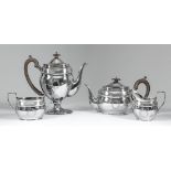 An Elizabeth II silver oval four piece tea and coffee service with slightly domed covers, reeded