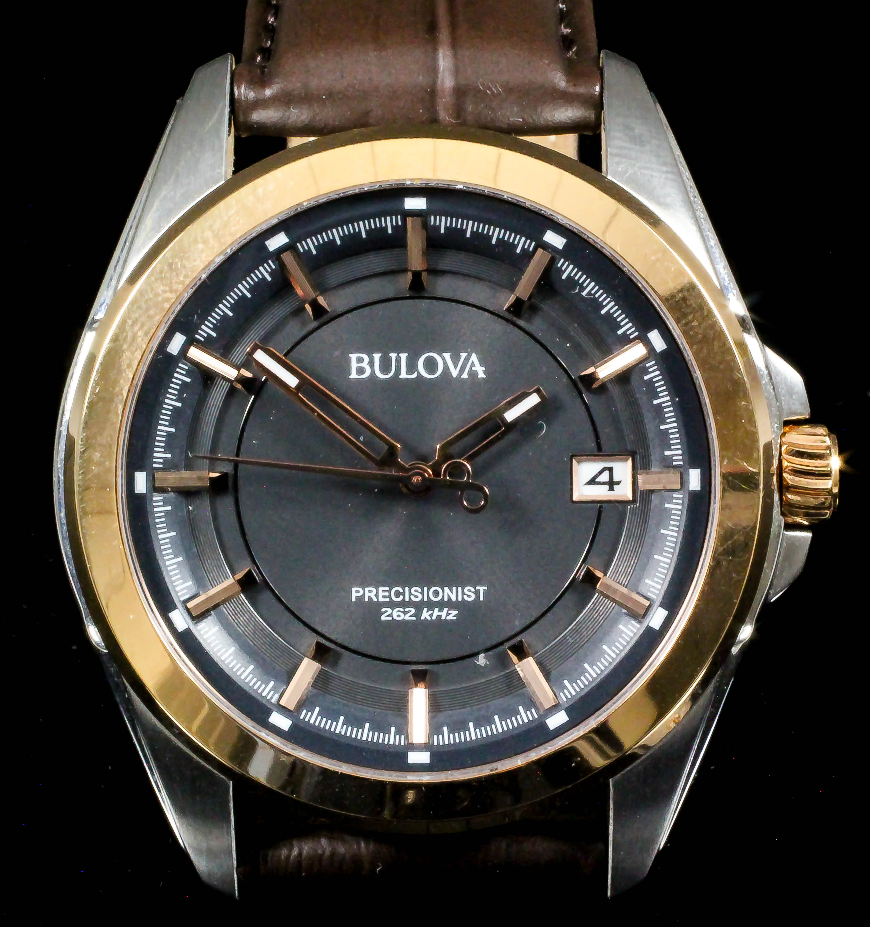 A gentleman's automatic wristwatch by Bulova, the grey dial with gold batons and date aperture, 43mm