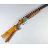 A 12 bore over and under shotgun by Winchester model 91, Serial No. 220285, the 28ins blued steel