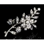 An early 20th Century silvery coloured metal mounted all-diamond flowerhead pattern brooch, set with