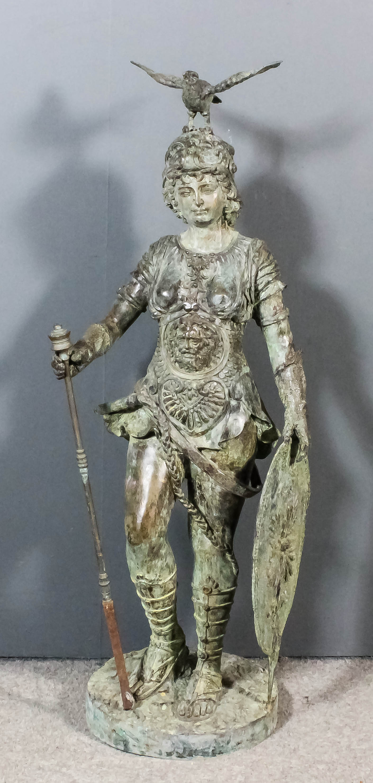An 'antiqued' patinated bronze standing figure of Bellona - the Roman goddess of war ,wearing ornate