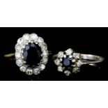 An 18ct gold mounted sapphire and diamond set oval cluster ring, set with central sapphire (