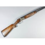 A 12 bore over and under shotgun by Lanber, Serial No. 26519, the 27.5ins blued steel barrels with