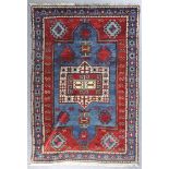 A Kazak Fakhralu rug dated 1320 (1902) woven in colours, the bold central pole medallion filled with