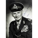 Field Marshal B.L. Montgomery (1887-1976) - A black and white portrait photograph, signed Montgomery