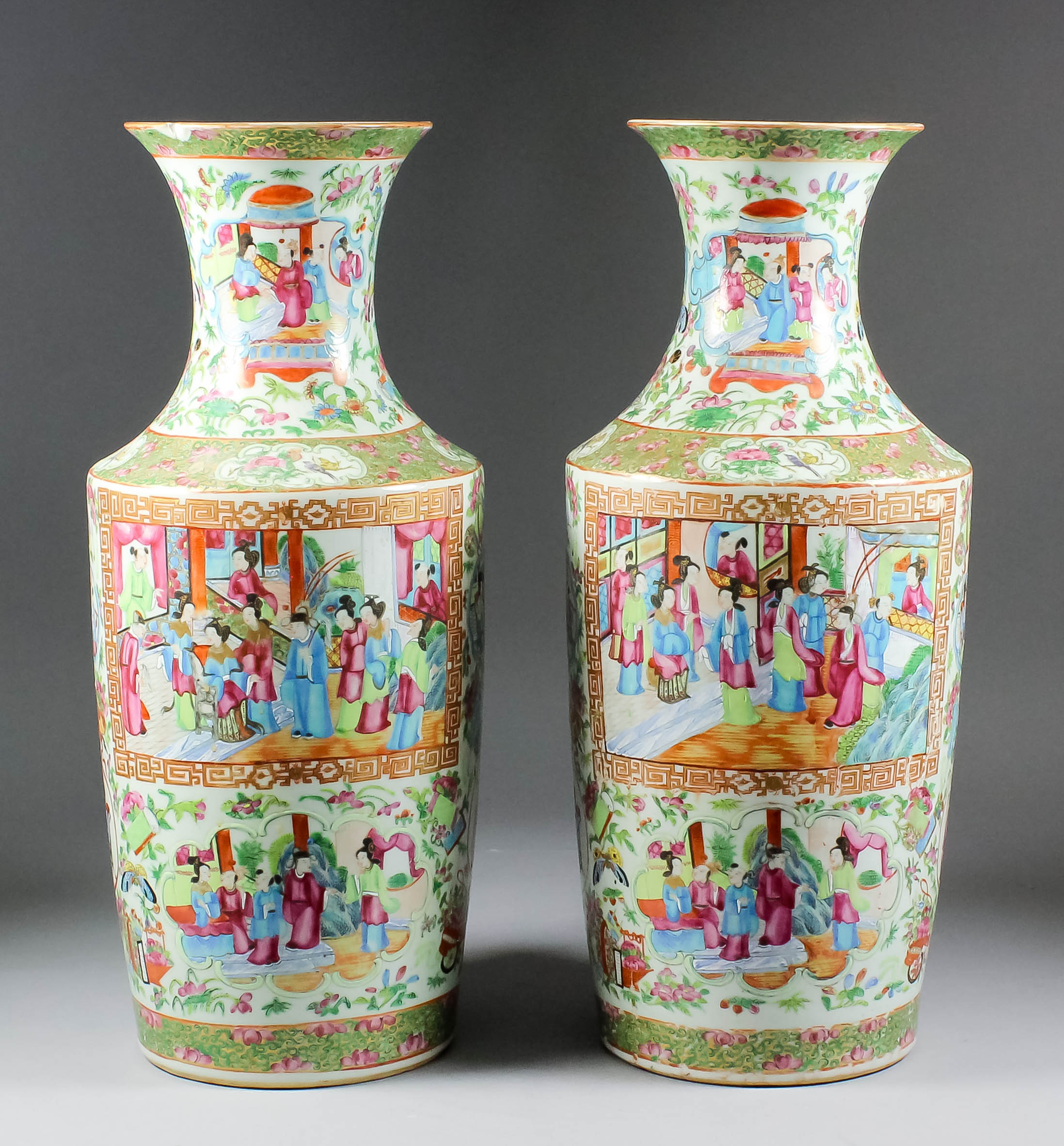 A pair of Chinese "Cantonese" baluster shaped vases, enamelled in colours with standing figures