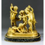 A 19th Century French gilt bronze group of infant bacchantes and three putti at play with goat, on