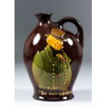 A Royal Doulton "Kingsware" pottery whisky flask made for Dewar's Whisky, the front decorated with