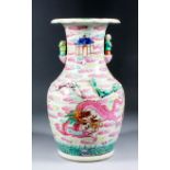 A Chinese "Famille Rose" porcelain baluster shaped vase with turned over rim, figural pattern