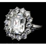 A good modern 18ct white gold mounted diamond cluster ring set with an octagonal cut central diamond