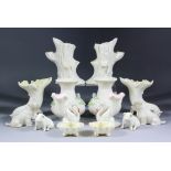 A small collection Belleek porcelain, including - pair of cornucopia vases, 5ins high, a pair of