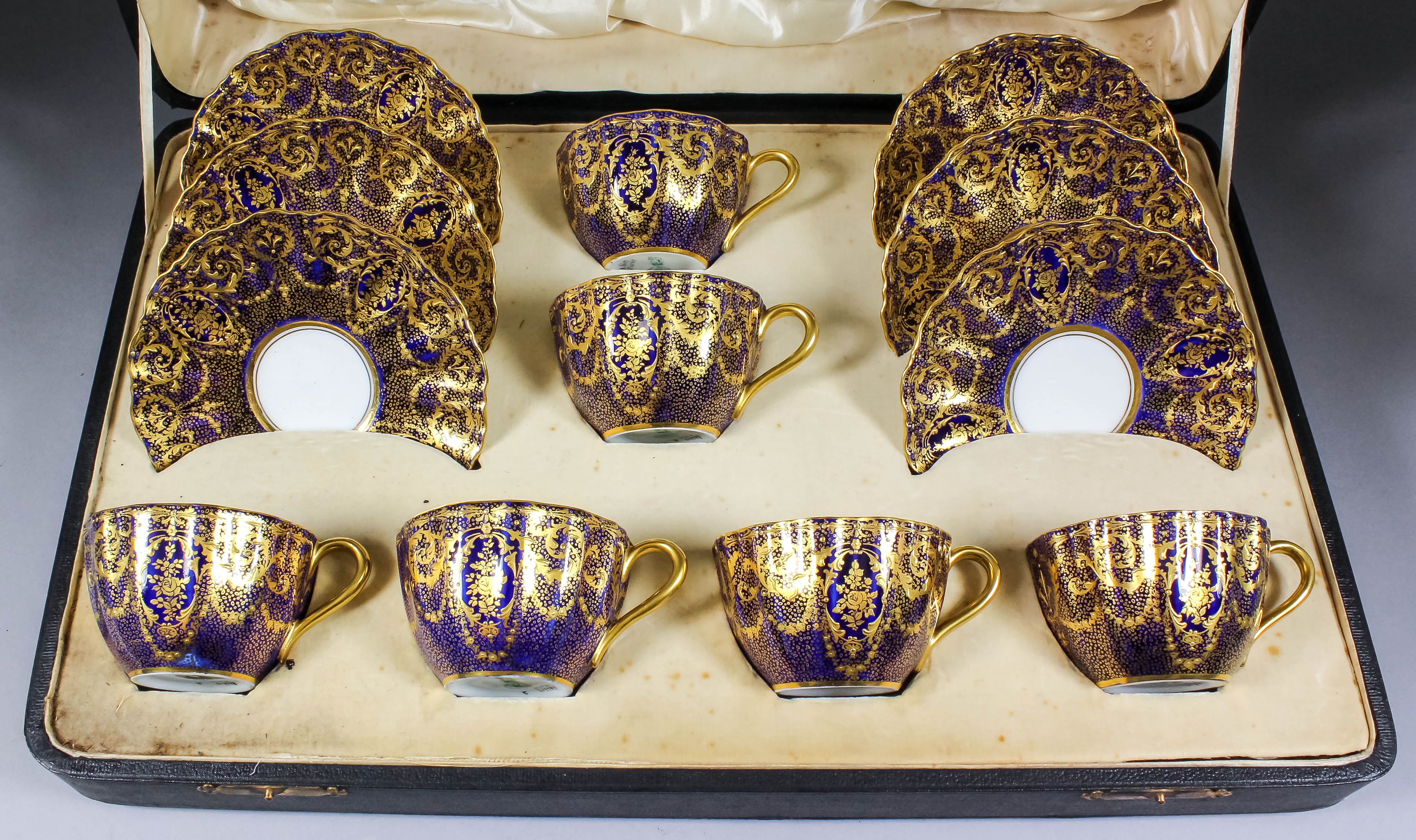 A set of six early 20th Century Royal Doulton bone china teacups and saucers decorated with